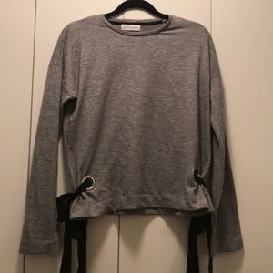 Long sleeve tee with side tie grommet detail